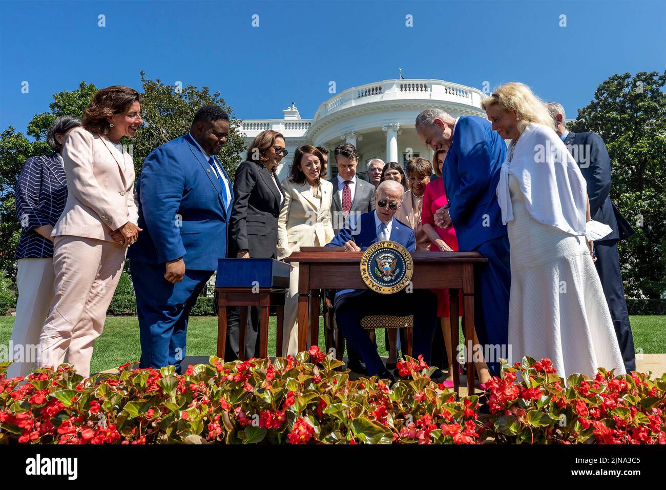 Washington, United States Of America. 09th Aug, 2022. Washington, United States of America. 09 August, 2022. U.S President Joe Biden, surrounded by lawmakers signs into law H.R. 4346, the CHIPS and Science Act of 2022 during a ceremony on the South Lawn of the White House August 9, 2022 in Washington, DC Credit: Adam Schultz/White House Photo/Alamy Live News Stock Photo
