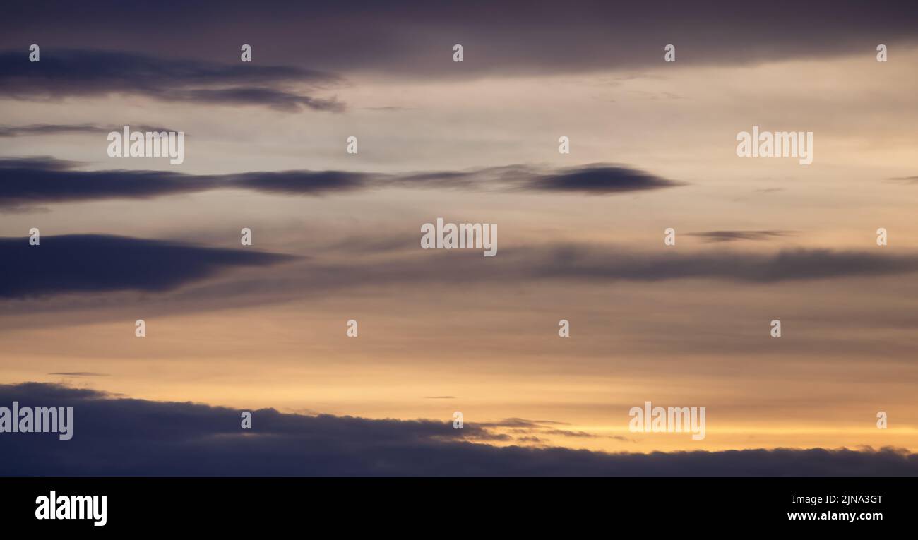 View of Dramatic Cloudscape during a colorful sunset or sunrise. Stock Photo