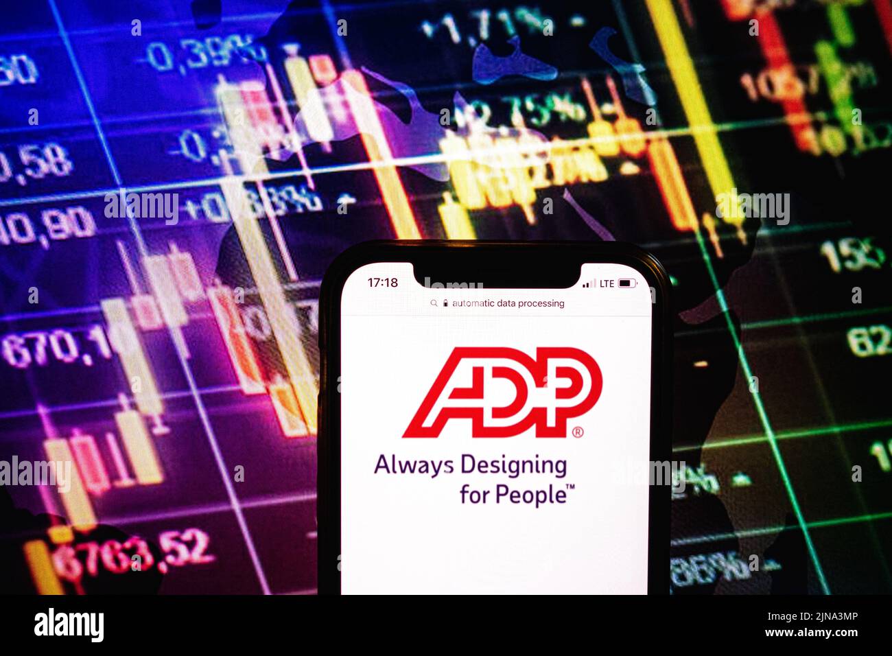 KONSKIE, POLAND - August 09, 2022: Smartphone displaying logo of Automatic Data Processing company on stock exchange diagram background Stock Photo