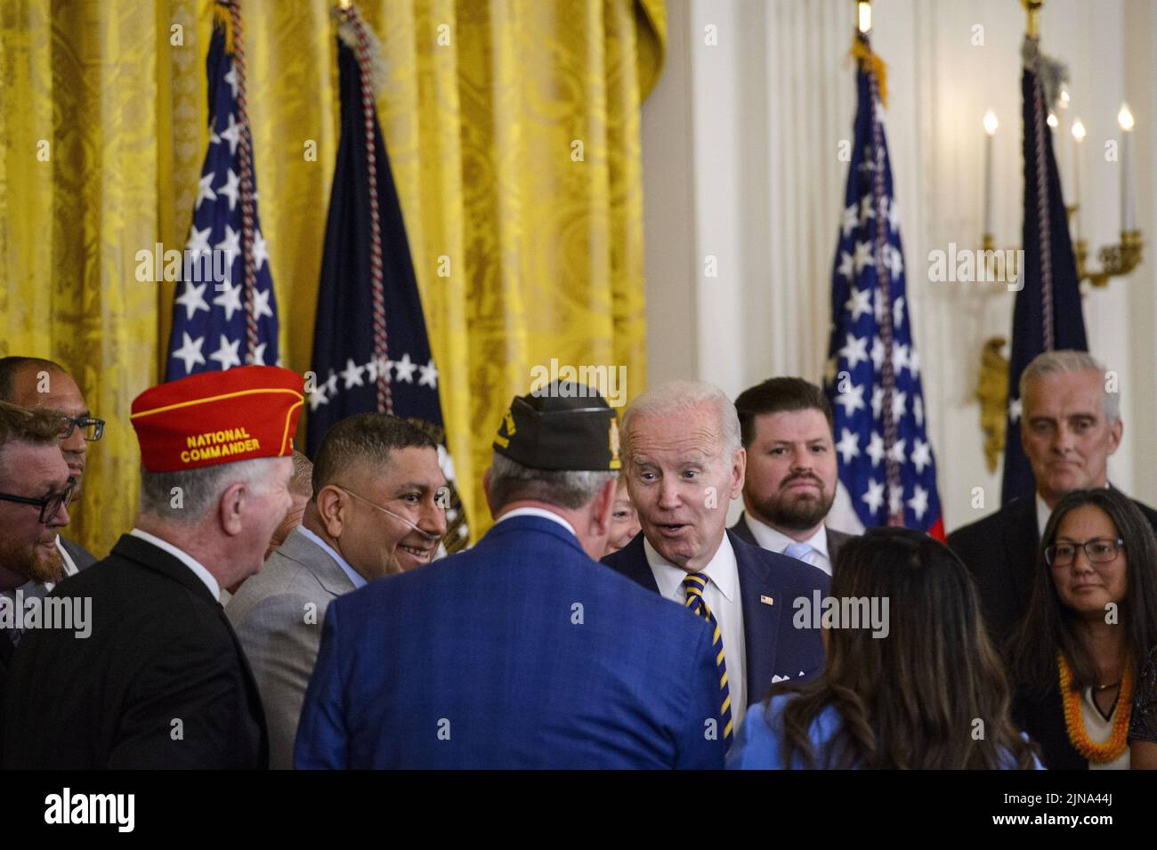 Washington, United States. 10th Aug, 2022. President Joe Biden greets veterans after signing the PACT Act of 2022, a bill to expand health care benefits for veterans exposed to toxic burn pits, in the East Room of the White House in Washington, DC on Wednesday, August 10, 2022. Photo by Bonnie Cash/UPI Credit: UPI/Alamy Live News Stock Photo