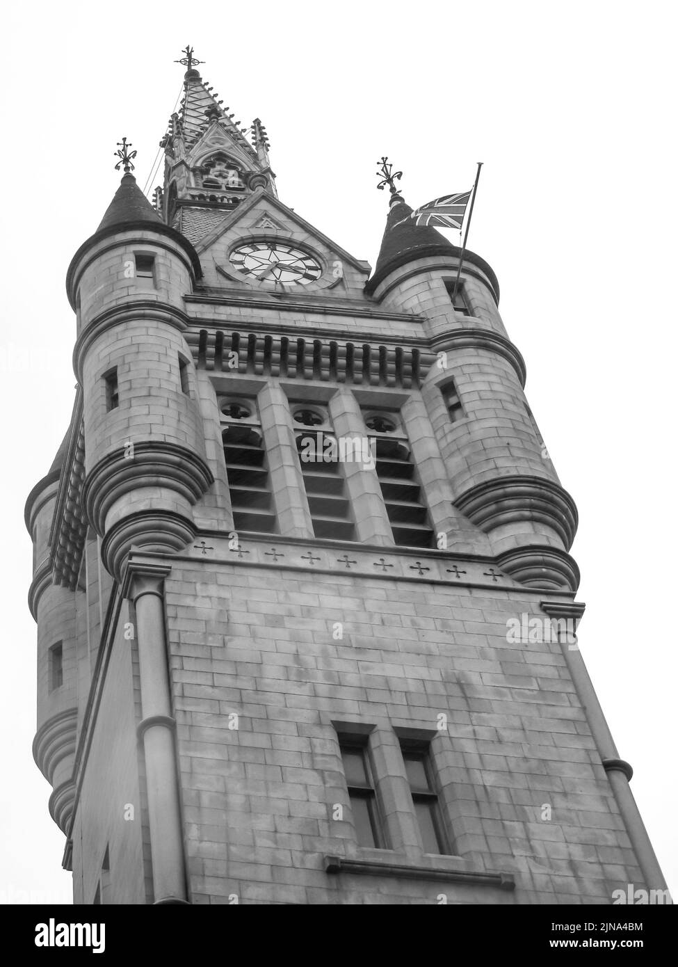 Looking up at the tower of the 17th century Tolbooth in Aberdeen, Scotland, in black and white Stock Photo