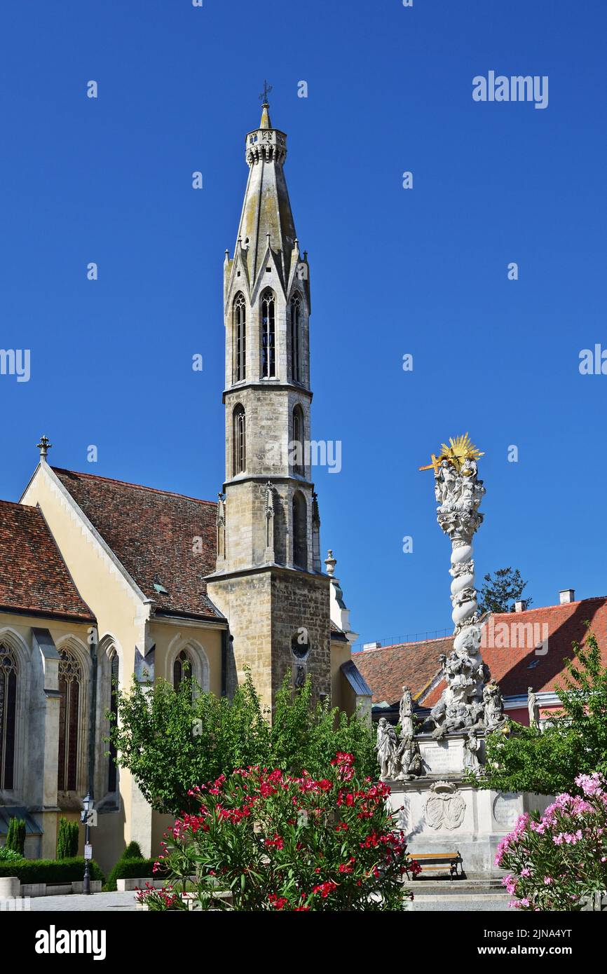 Goat church and Holy Trinity statue in Sopron, Hungary Stock Photo