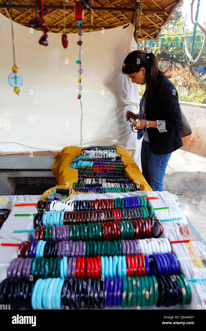 Young woman bangle shopping in a street market, New Delhi, India Stock Photo