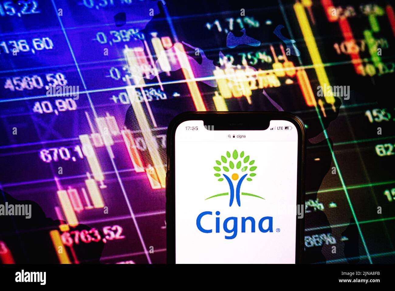 KONSKIE, POLAND - August 09, 2022: Smartphone displaying logo of Cigna company on stock exchange diagram background Stock Photo