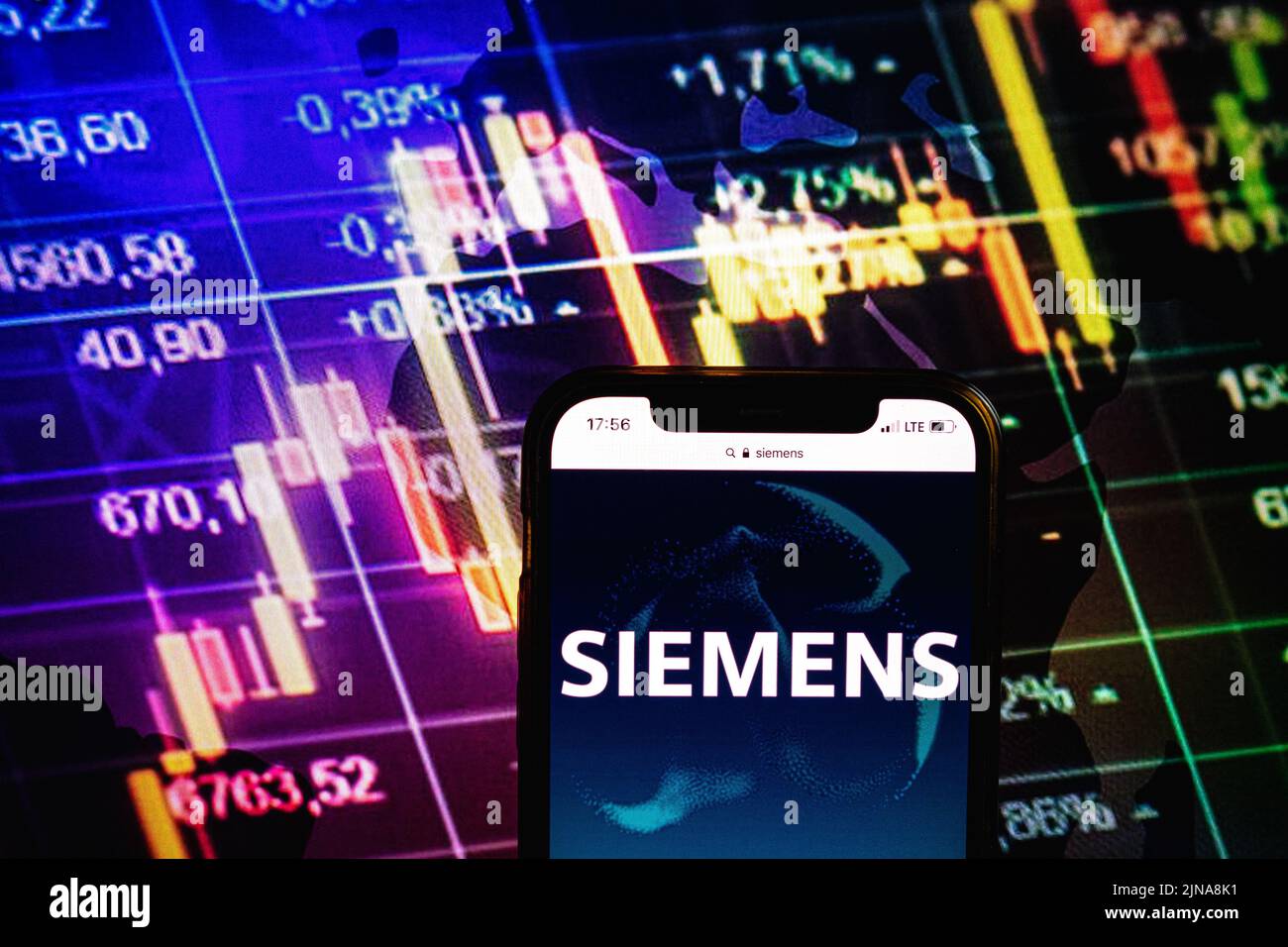 KONSKIE, POLAND - August 09, 2022: Smartphone displaying logo of Siemens company on stock exchange diagram background Stock Photo