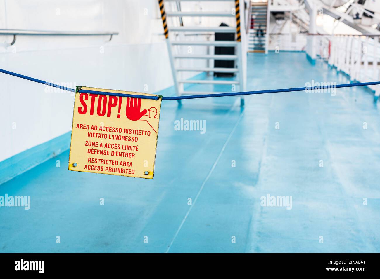 stop sign on walking deck on the ship at sea Stock Photo