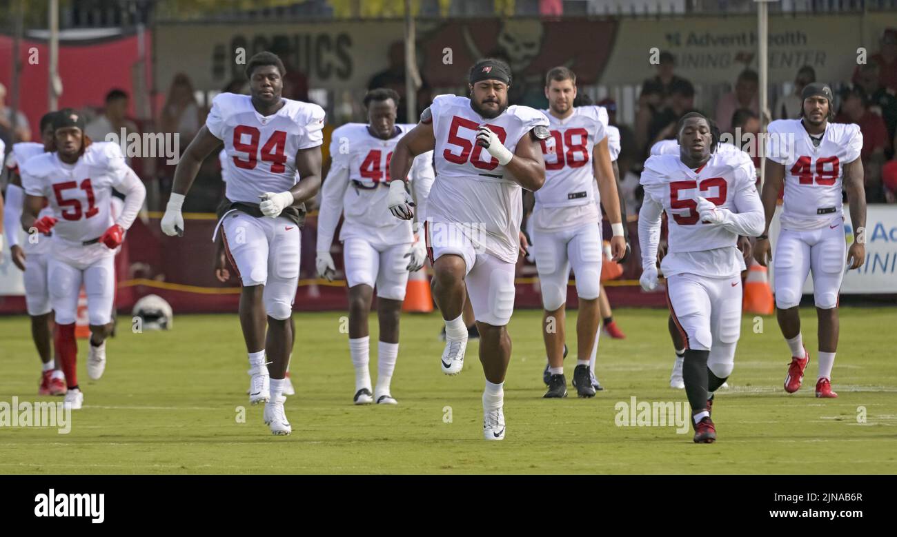 Tampa, United States. 10th Aug, 2022. Tampa Bay Buccaneers nose tackle Vita Vea (5), Willington Previlon (94) and K.J. Britt (52) lead teammates as they loosen up before a joint practice with the Miami Dolphins at the Buccaneer's training center in Tampa, Florida on Wednesday, August 10, 2022. Photo by Steve Nesius/UPI Credit: UPI/Alamy Live News Stock Photo