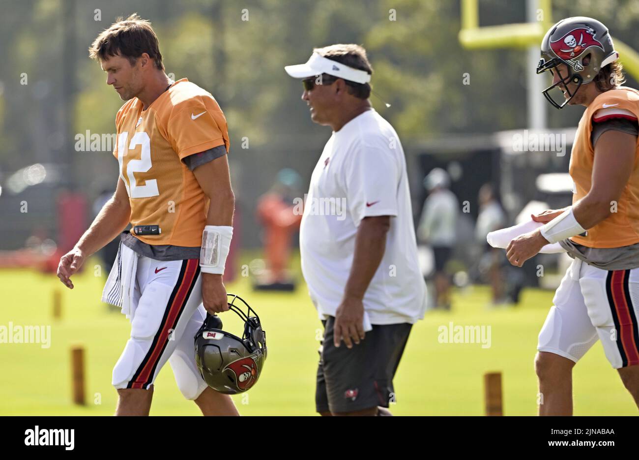 Tampa, United States. 10th Aug, 2022. Tampa Bay Buccaneers quarterback Tom Brady (12), leads quarterbacks coach Clyde Christensen (C) and Blaine Gabbert as they switch fields during a joint practice with the Miami Dolphins at the Buccaneer's training center in Tampa, Florida on Wednesday, August 10, 2022. Photo by Steve Nesius/UPI Credit: UPI/Alamy Live News Stock Photo