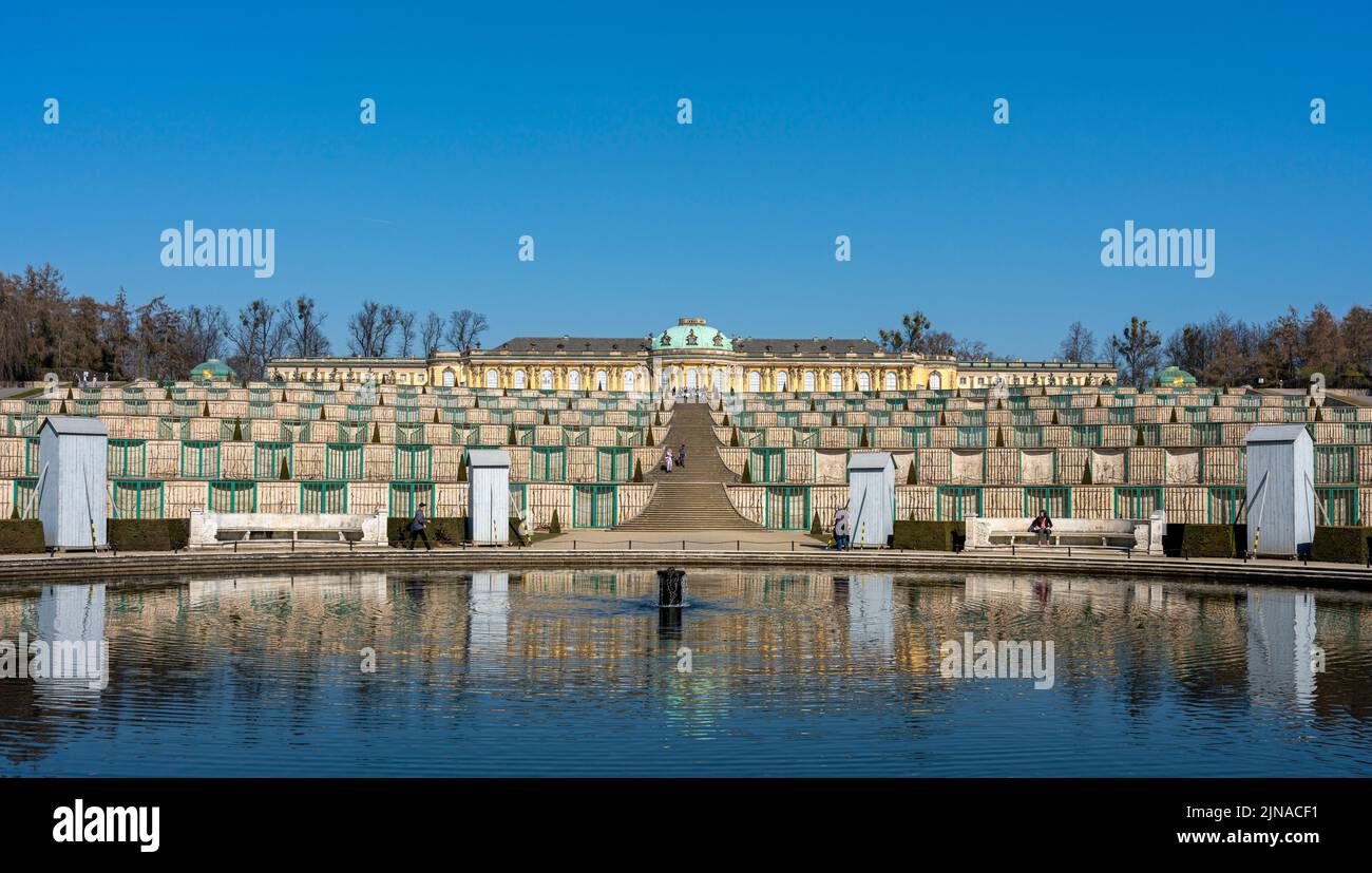 Sanssouci Palace In March With Wood Paneling On The Figures Around The Fountain In Front Of The Grand Staircase, Potsdam, Brandenburg, Germany Stock Photo