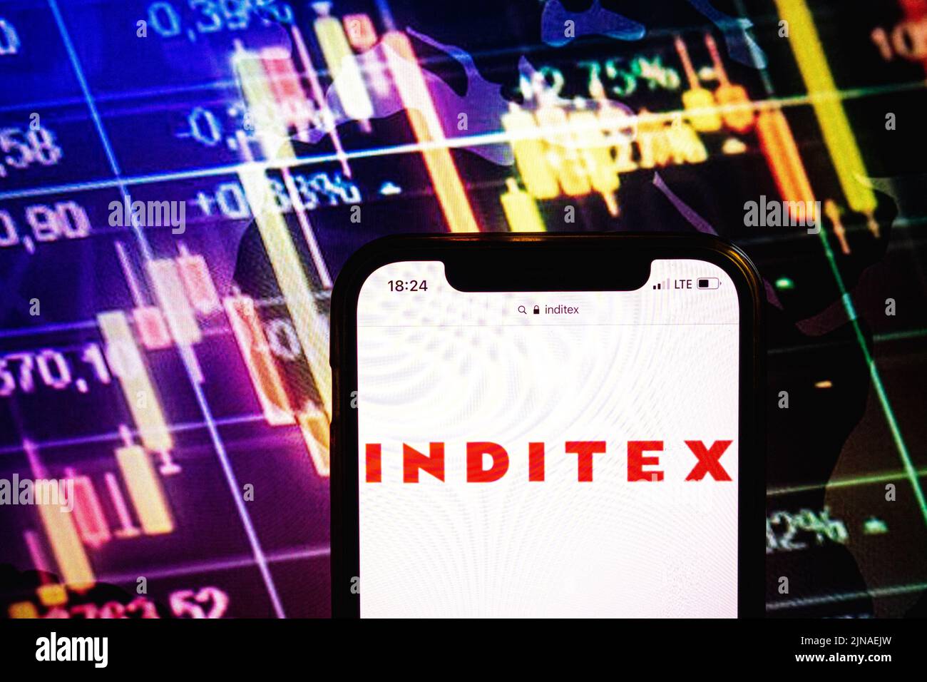 KONSKIE, POLAND - August 09, 2022: Smartphone displaying logo of Inditex company on stock exchange diagram background Stock Photo