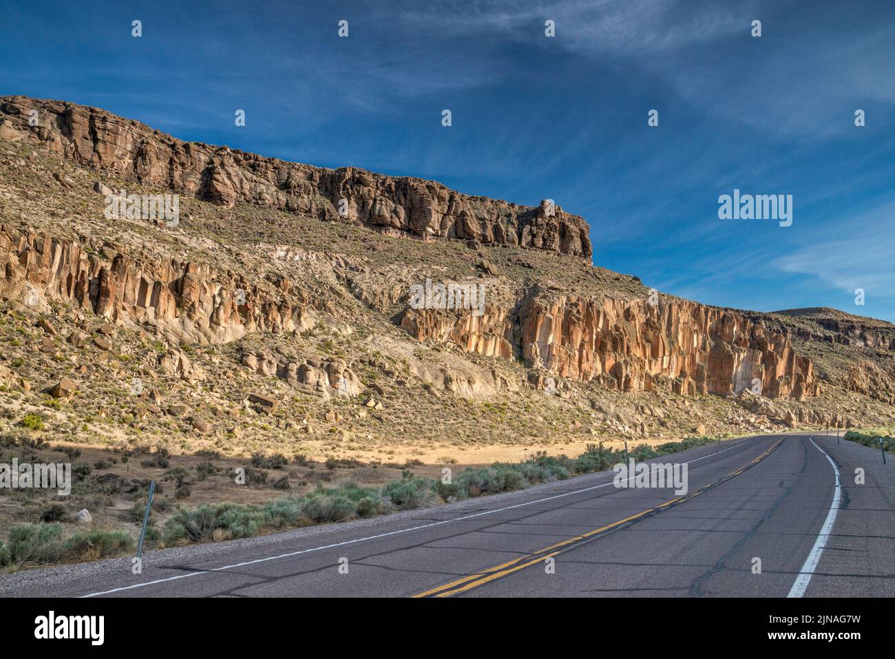 Tuff cliffs at SR 318 highway, White River Narrows, Basin and Range National Monument, Nevada, USA Stock Photo