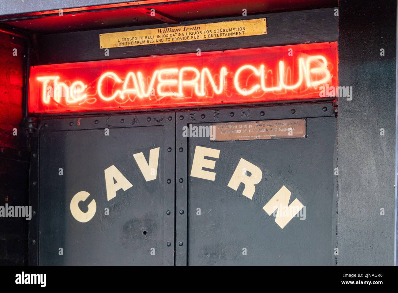 neon sign and doors to the Cavern Club wherwe the beatles played in the 1960s in Liverpool Merseyside Stock Photo