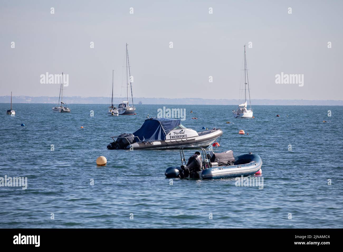 Boats in Swanage Bay on a summers morning in August, Dorset, England Stock Photo