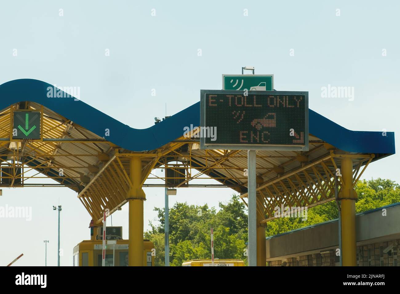 Expressway sign on tollgate shows way for car drivers paying with bank credit card. Blue expressway checkpoint on toll highway closeup Stock Photo