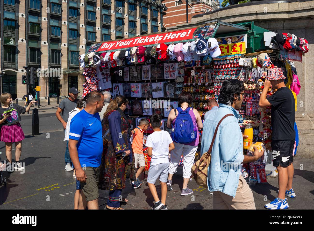 Souvenir stand on the end of Westminster Bridge selling British gifts for tourists. London and British souvenirs on display for sale. People looking Stock Photo