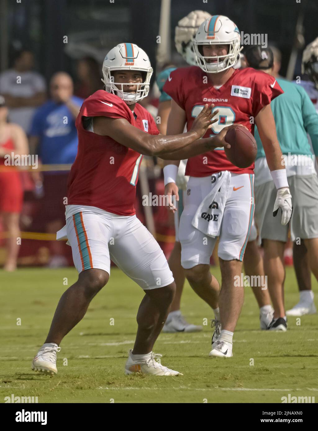 Tampa, United States. 10th Aug, 2022. Miami Dolphins' quarterback Tua Tagovailoa (L) looks to pass during a joint practice at the Buccaneer's training center in Tampa, Florida on Wednesday, August 10, 2022. Photo by Steve Nesius/UPI Credit: UPI/Alamy Live News Stock Photo