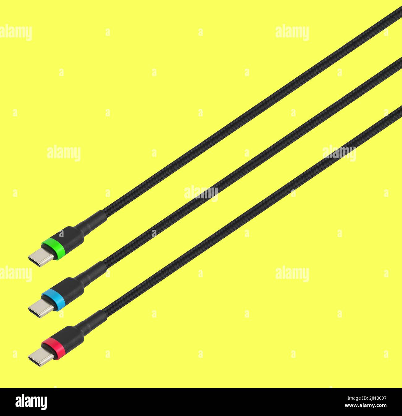 three cables with TypeC connector, in RGB colors, isolated on a yellow