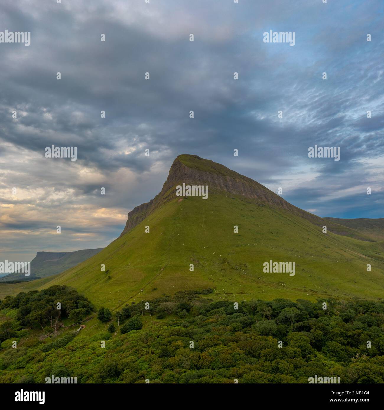 View of the sunset and overcast sky in the evening around Bunbeg table top mountain in County