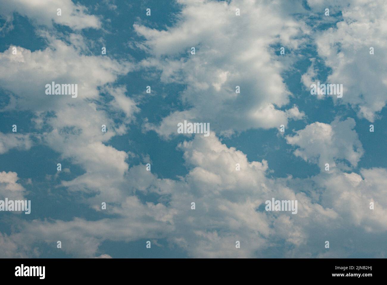 white wispy clouds against blue sky Stock Photo