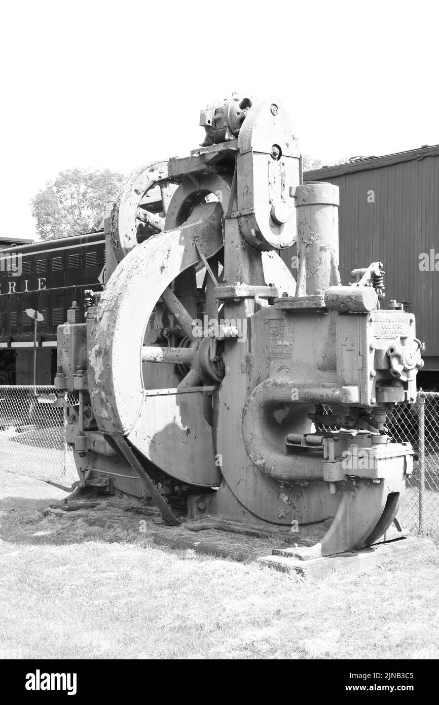 The vertical grayscale of an antique industrial machinery Stock Photo