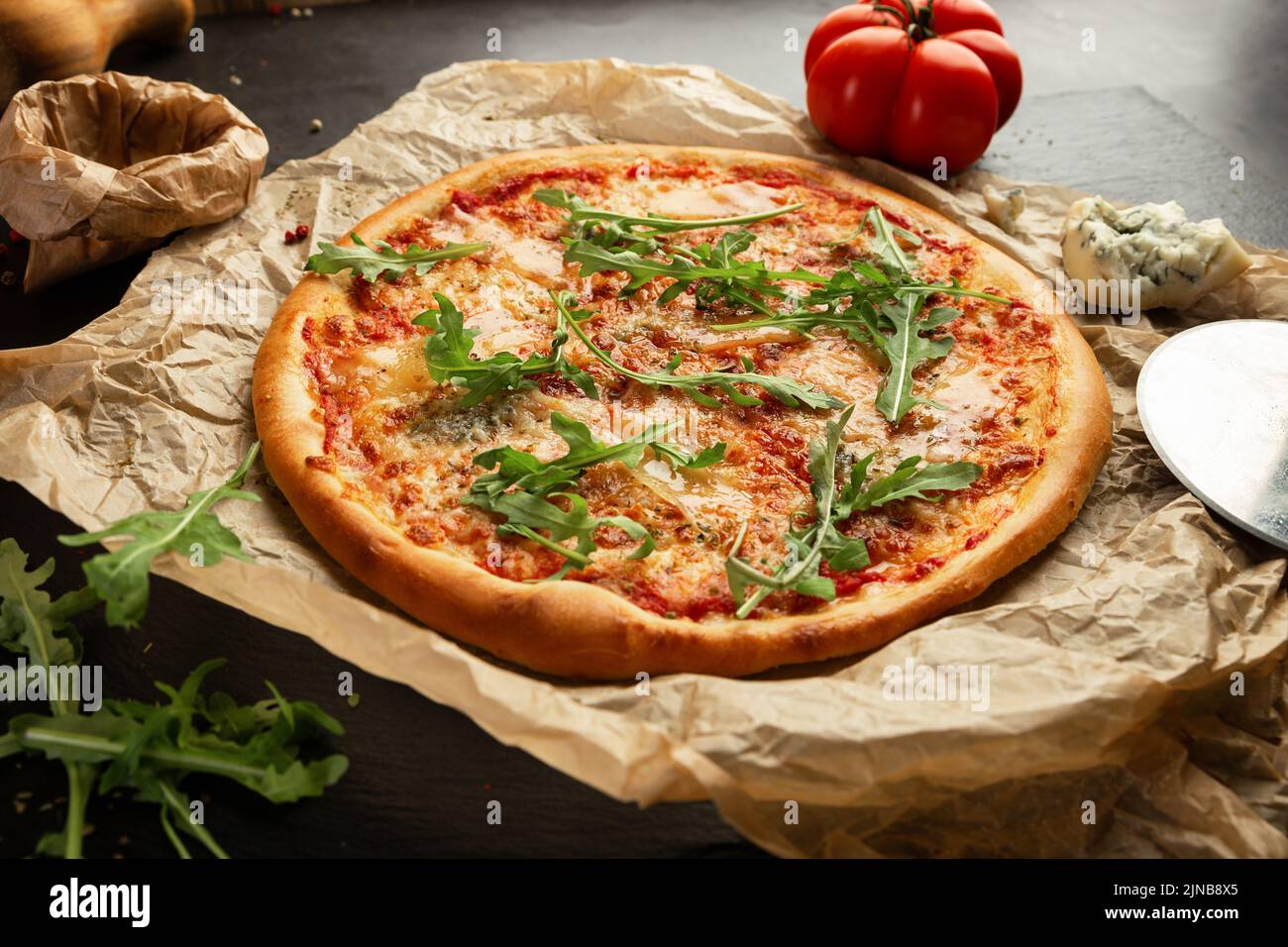 Cheese pizza with rucola and some ingredients Stock Photo - Alamy