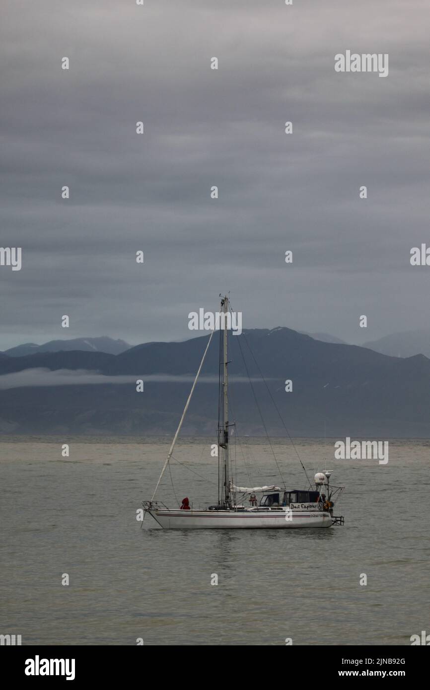 A sailboat anchored near Pond Inlet, Nunavut waiting for weather to transit through the Northwest Passage, Canada Stock Photo