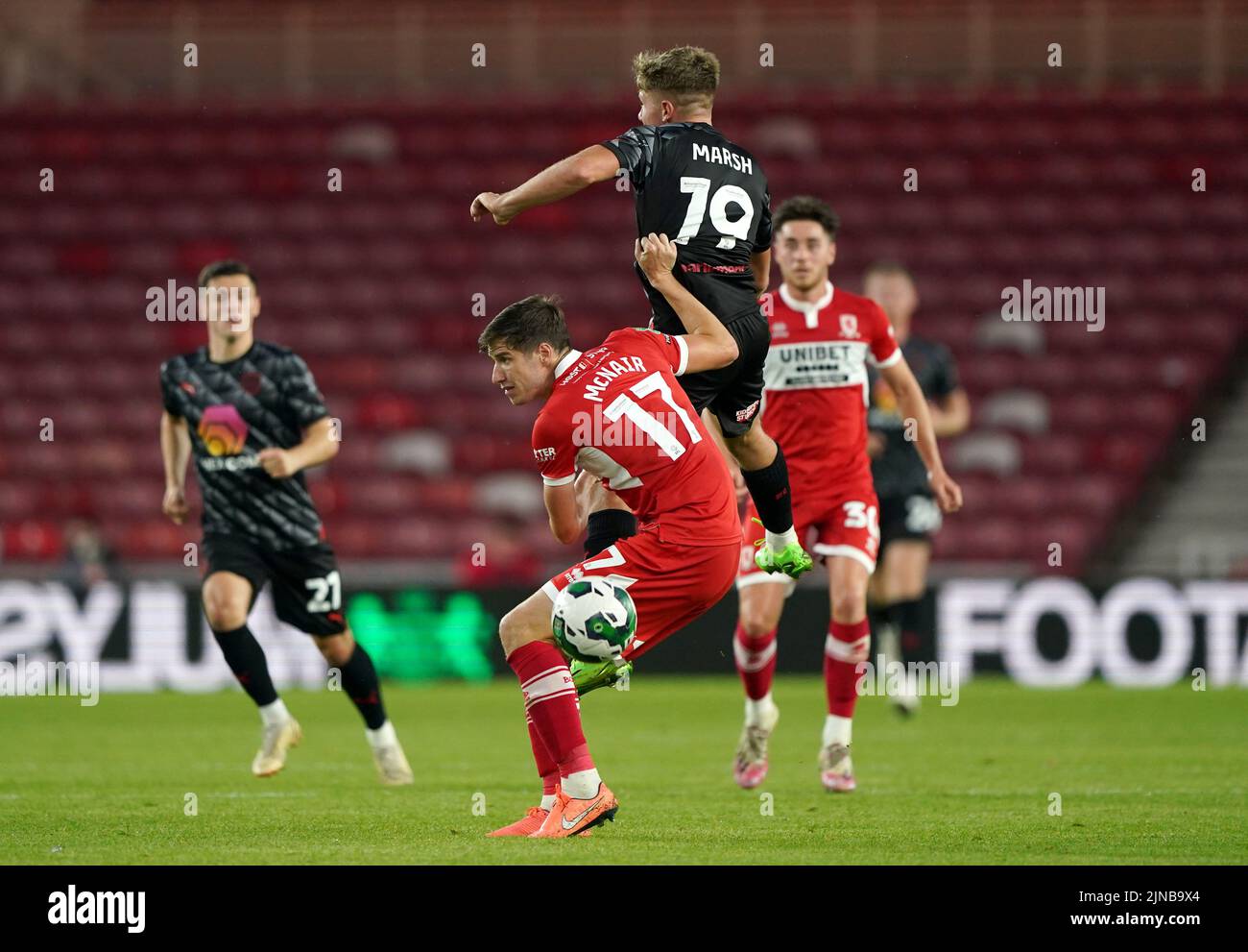 Middlesbrough's Paddy McNair (bottom) and Barnsley's Aiden Marsh battle for the ball during the Carabao Cup, first round match at the Riverside Stadium, Middlesbrough. Picture date: Wednesday August 10, 2022. Stock Photo