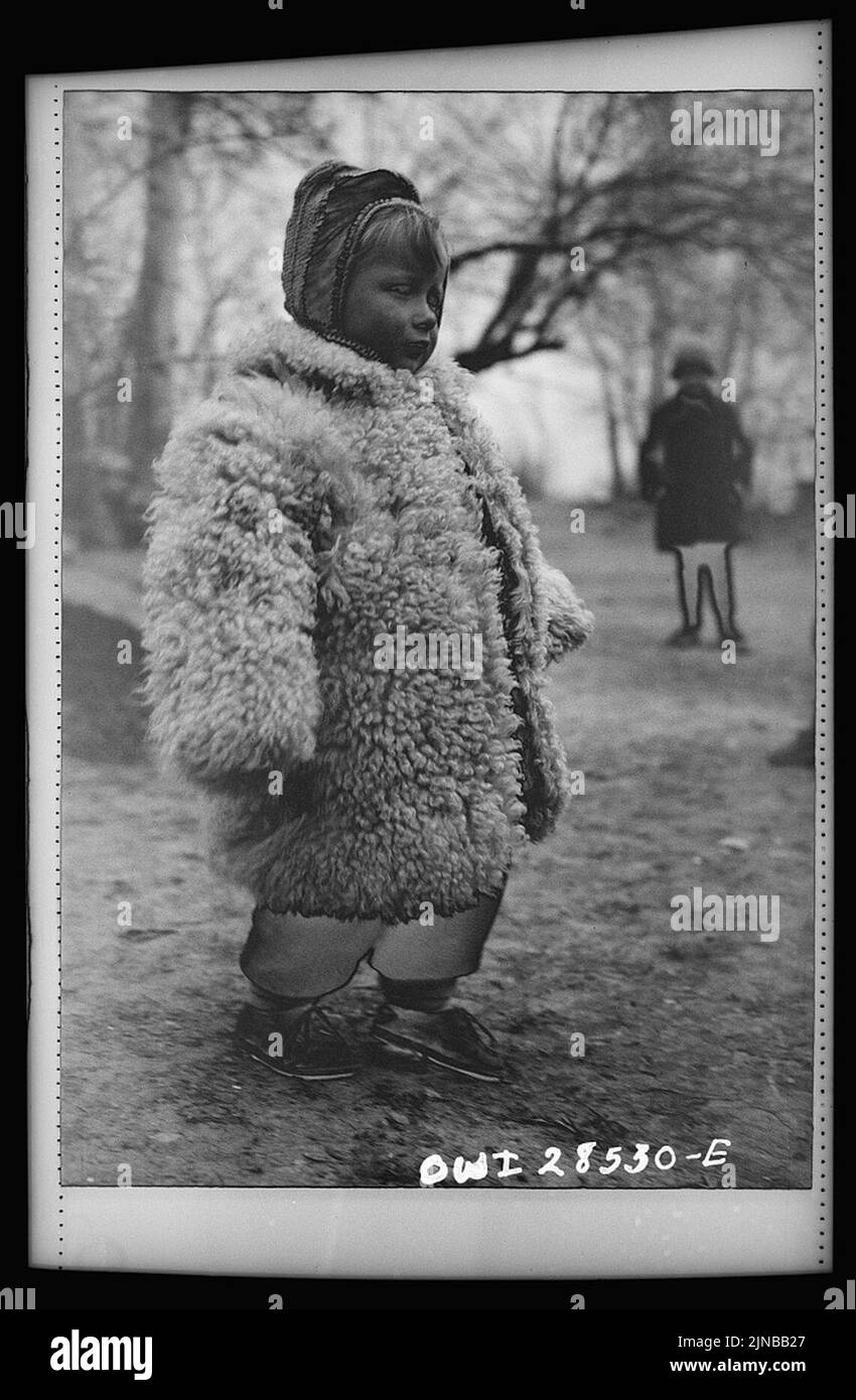 Teheran, Iran. Little Polish girl in a big sheepskin coat who is at an evacuation camp operated by the Red Cross8d29643v Stock Photo