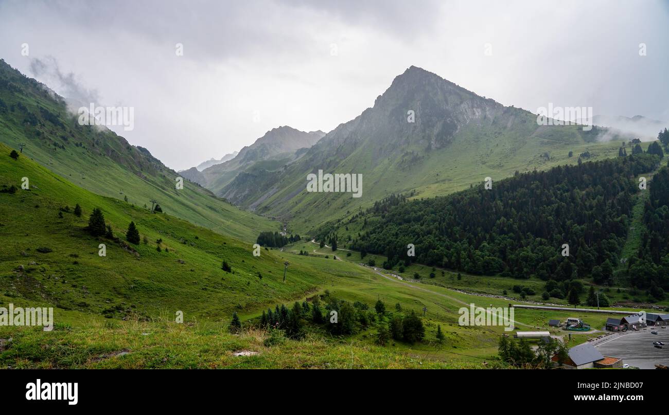 Scattered Ranges a mountain range, slopes covered by trees and grass and scattered low ...