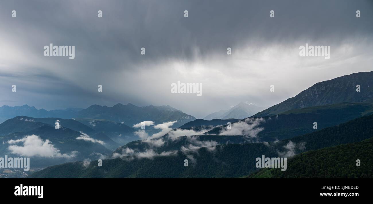 Scattered Ranges a mountain range, slopes covered by trees and grass and scattered low ...