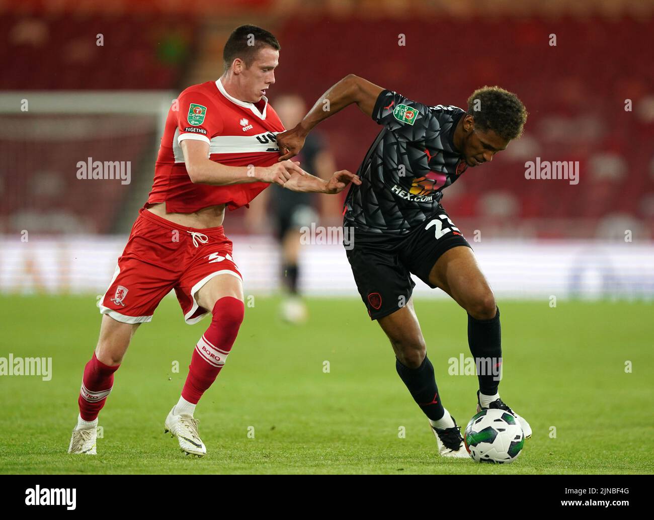 Middlesbrough's Daniel Dodds (left) and Barnsley's William Hondermarck battle for the ball during the Carabao Cup, first round match at the Riverside Stadium, Middlesbrough. Picture date: Wednesday August 10, 2022. Stock Photo