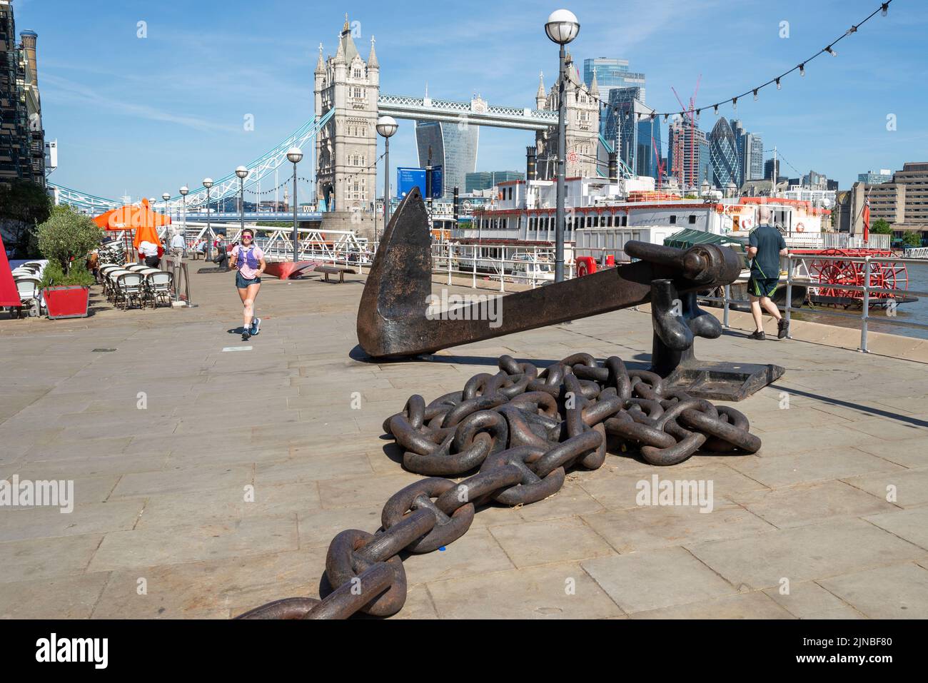 Thames Path and restaurants below Butler's Wharf, historic building at Shad Thames on south bank of the River Thames, near London's Tower Bridge Stock Photo
