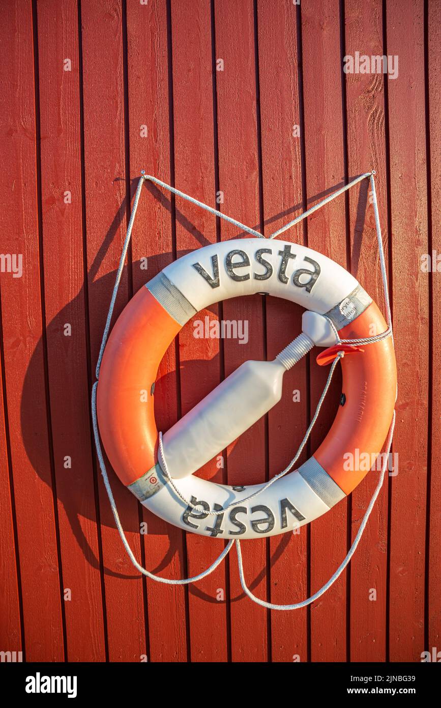 Lifebuoy on a rorbuer red hut in Hamnoy, Lofoten Islands, Norway Stock Photo
