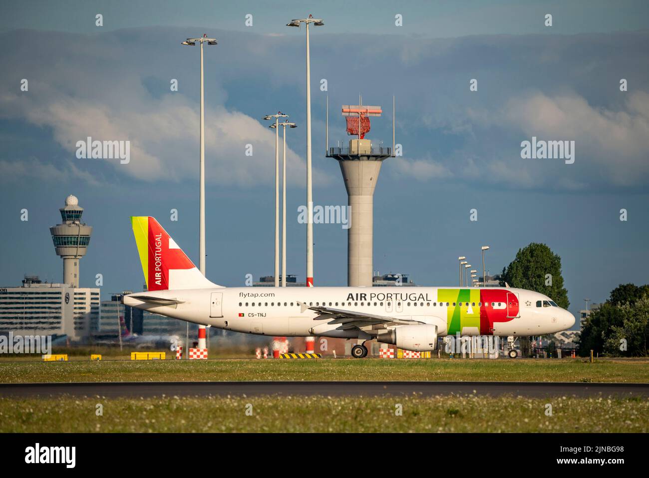 Amsterdam Shiphol Airport, Polderbaan, one of 6 runways, tower air traffic control, CS-TNJ, TAP - Air Portugal Airbus A320-200, on taxiway to take-off Stock Photo