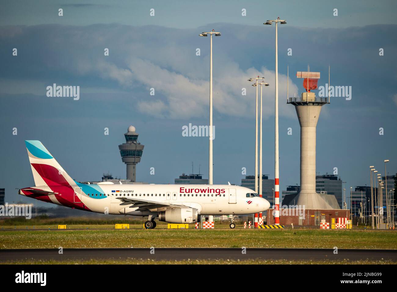 Amsterdam Shiphol Airport, Polderbaan, one of 6 runways, tower air traffic control, D-AGWU, Eurowings Airbus A319-100, on the taxiway for take-off, Stock Photo