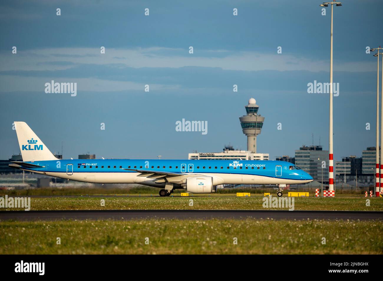 Amsterdam Shiphol Airport, Polderbaan, one of 6 runways, tower air traffic control, on taxiway for take-off, PH-NXF, KLM Cityhopper Embraer E195-E2 Stock Photo