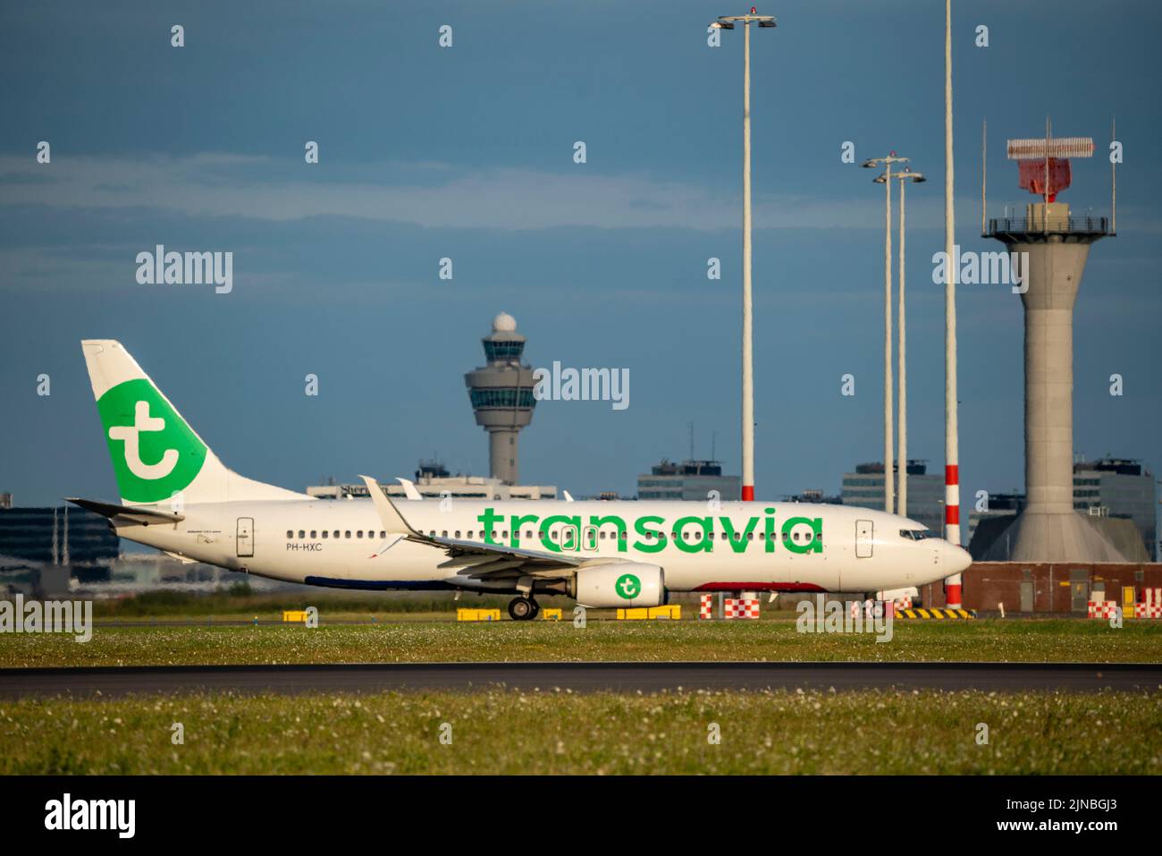 Amsterdam Shiphol Airport, Polderbaan, one of 6 runways, tower air traffic control, on taxiway to take-off, PH-HXC, Transavia Boeing 737-800. Stock Photo