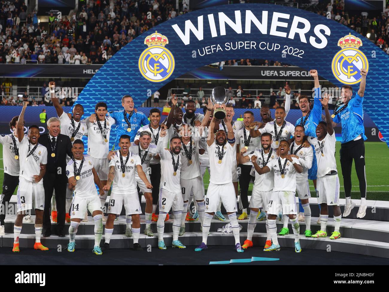 Soccer Football - European Super Cup - Real Madrid v Eintracht Frankfurt - Helsinki Olympic Stadium, Helsinki, Finland - August 10, 2022 Real Madrid's Karim Benzema lifts the trophy as he celebrates with teammates after winning the European Super Cup REUTERS/Kai Pfaffenbach     TPX IMAGES OF THE DAY Stock Photo