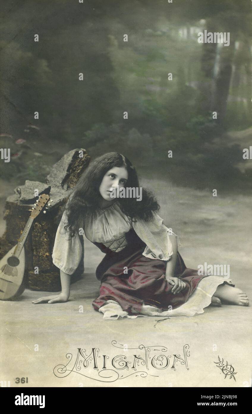 Vintage postcard with colorized photograph of actress portraying the character of Mignon from the stage performance based on Goethe's novel ' Wilhelm Meister Apprenticeship ' performance circa 1900 Stock Photo