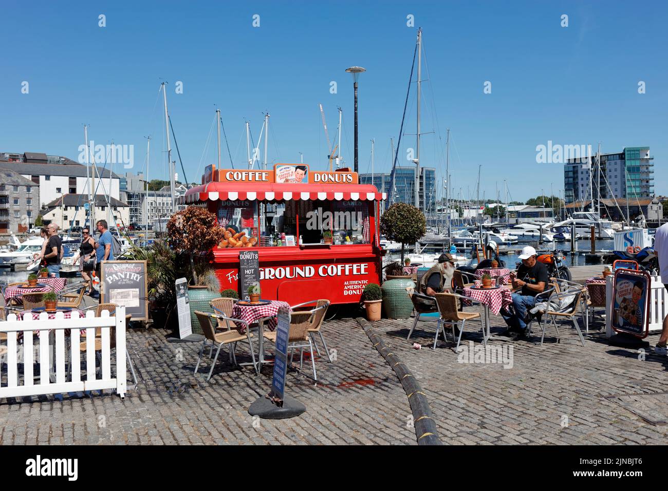 Plymouth, Devon, UK. 10th August, 2022. A sunny hot summer day at The Barbican in Plymouth.  Many boats dock at Sutton Harbour. Stock Photo