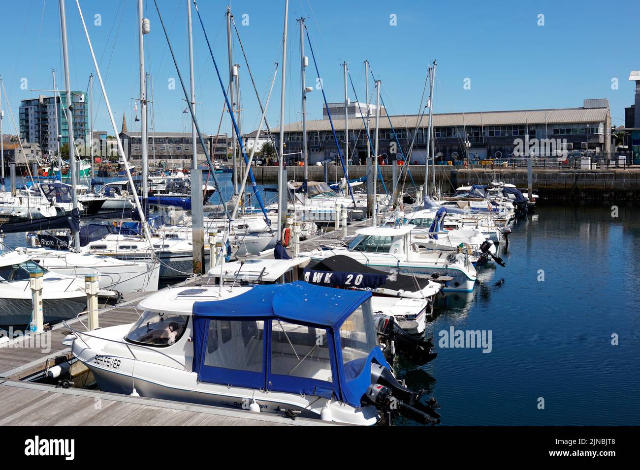 Plymouth, Devon, UK. 10th August, 2022. A sunny hot summer day at The Barbican in Plymouth.  Many boats dock at Sutton Harbour. Stock Photo