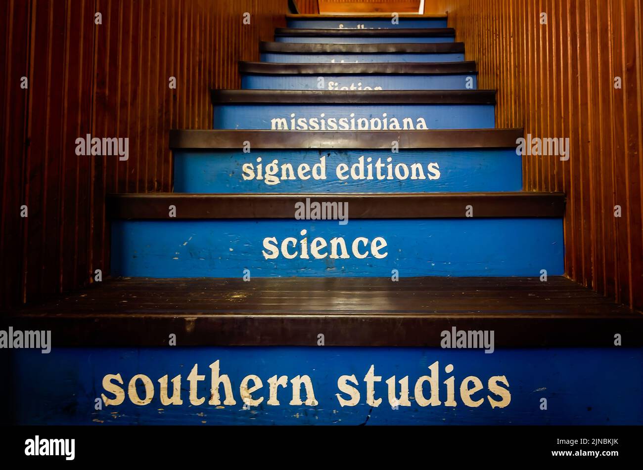 The staircase at Square Books is labeled with subjects ranging from Southern Studies to Signed Editions and Mississippiana in Oxford, Mississippi. Stock Photo
