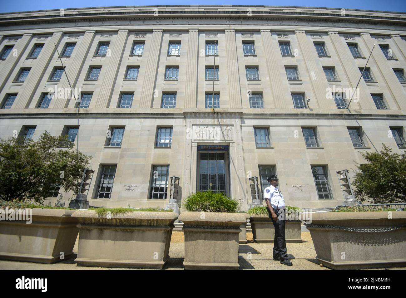 Washington, United States. 10th Aug, 2022. Security guard stands outside the Justice Department building in Washington, DC on Wednesday, August 10, 2022. The FBI executed a search warrant on August 9, 2022 of former President Donald Trump's Mar-a-Lago home in Palm Beach, Florida purportedly looking for classified documents that may have been taken from the White House when Trump left office in 2021. Photo by Bonnie Cash/UPI Credit: UPI/Alamy Live News Stock Photo