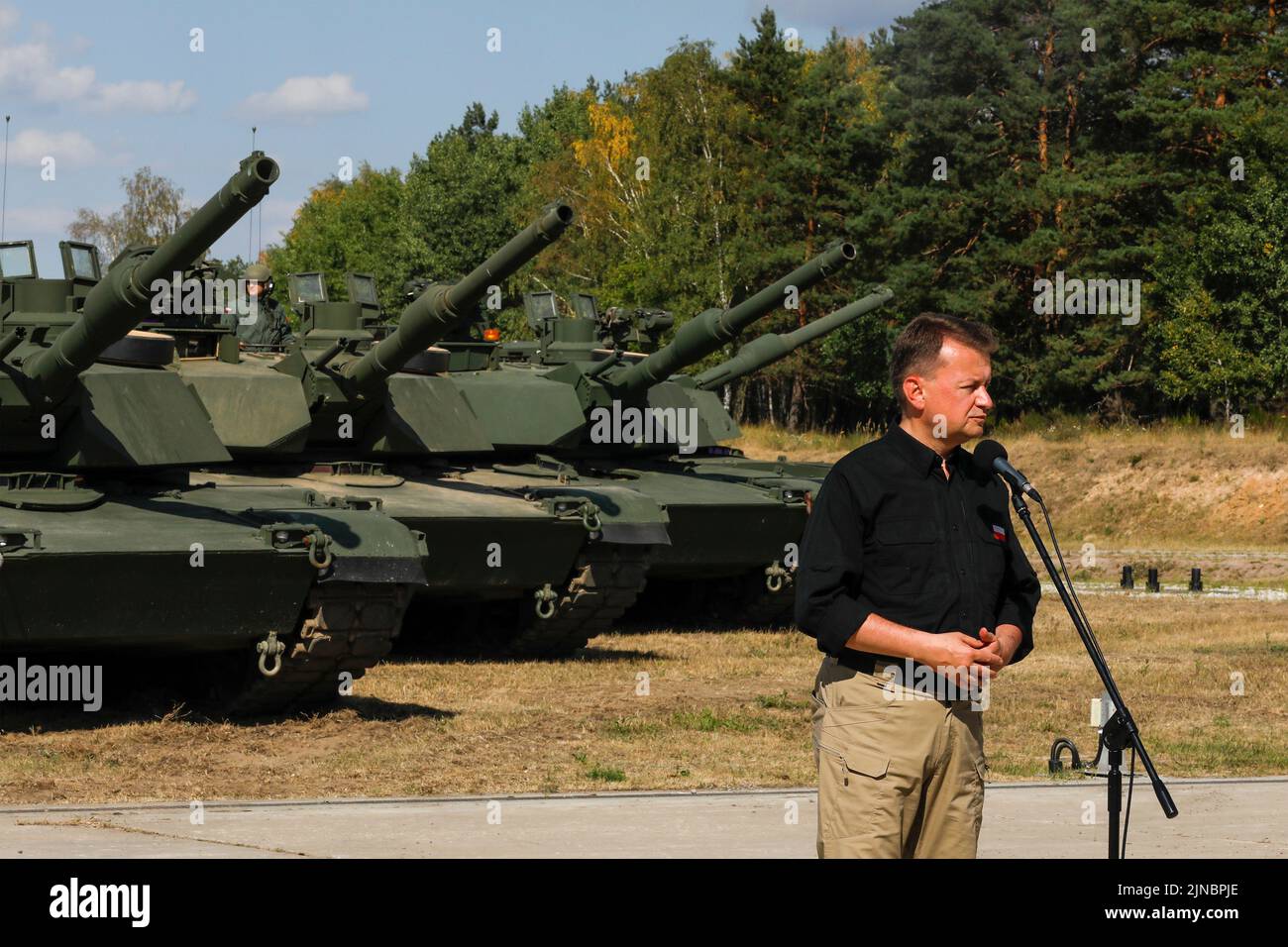 Biedrusko, Poland. 10th Aug, 2022. Polish Defense Minister Mariusz Blaszczak delivers remarks during the opening ceremony of the Abrams Tank Training Academy at the Land Forces Training Center August 10, 2022 in Biedrusko, Poland. The Abrams Tank Training Academy was established to teach Polish tank crewmen on operations, tactics and maintenance of the M1 Abrams main battle tank. Credit: Spc. Hassani Ribera/U.S Army/Alamy Live News Stock Photo