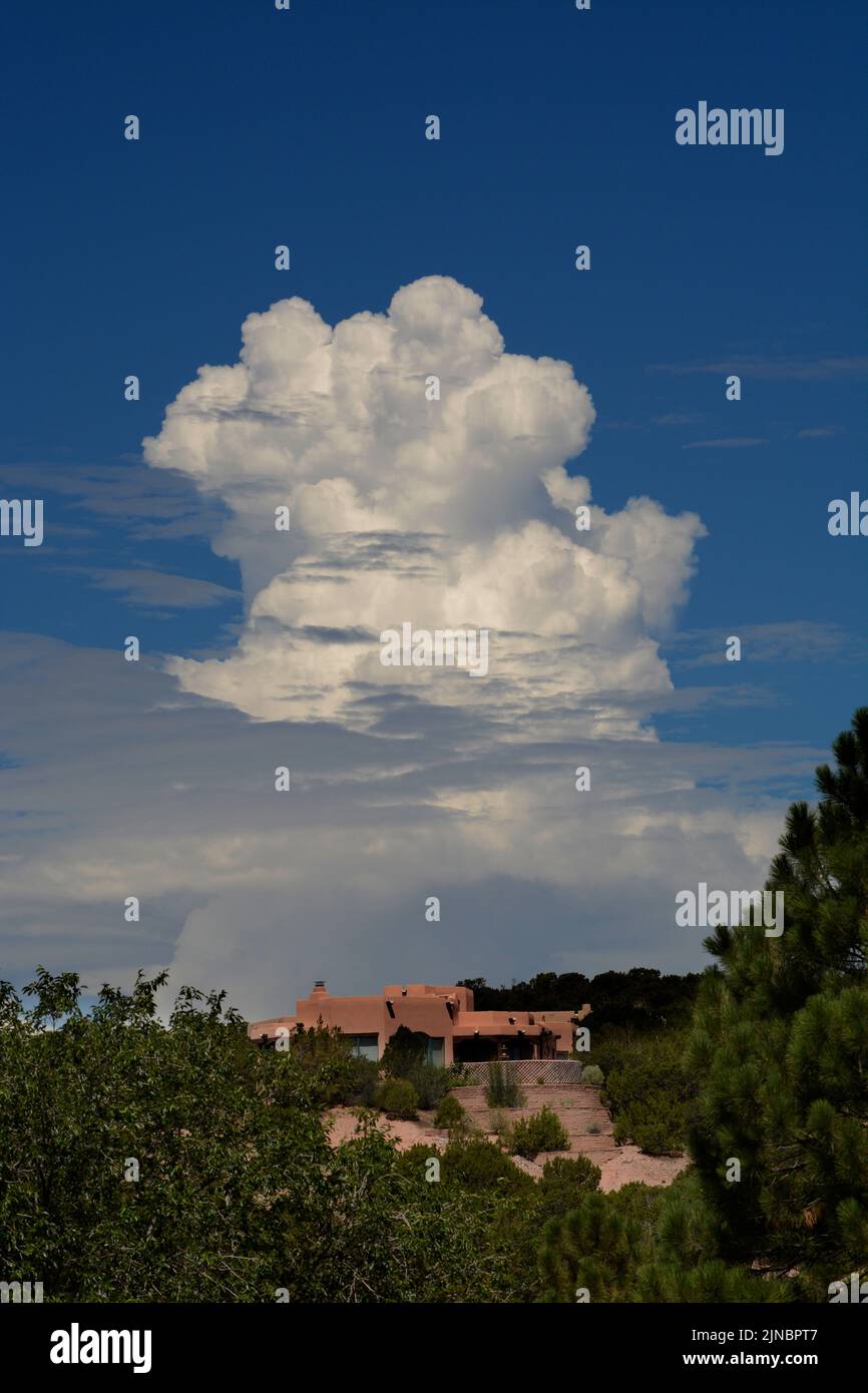 Towering cumulus clouds form on the horizon near Santa Fe, New Mexico. Stock Photo