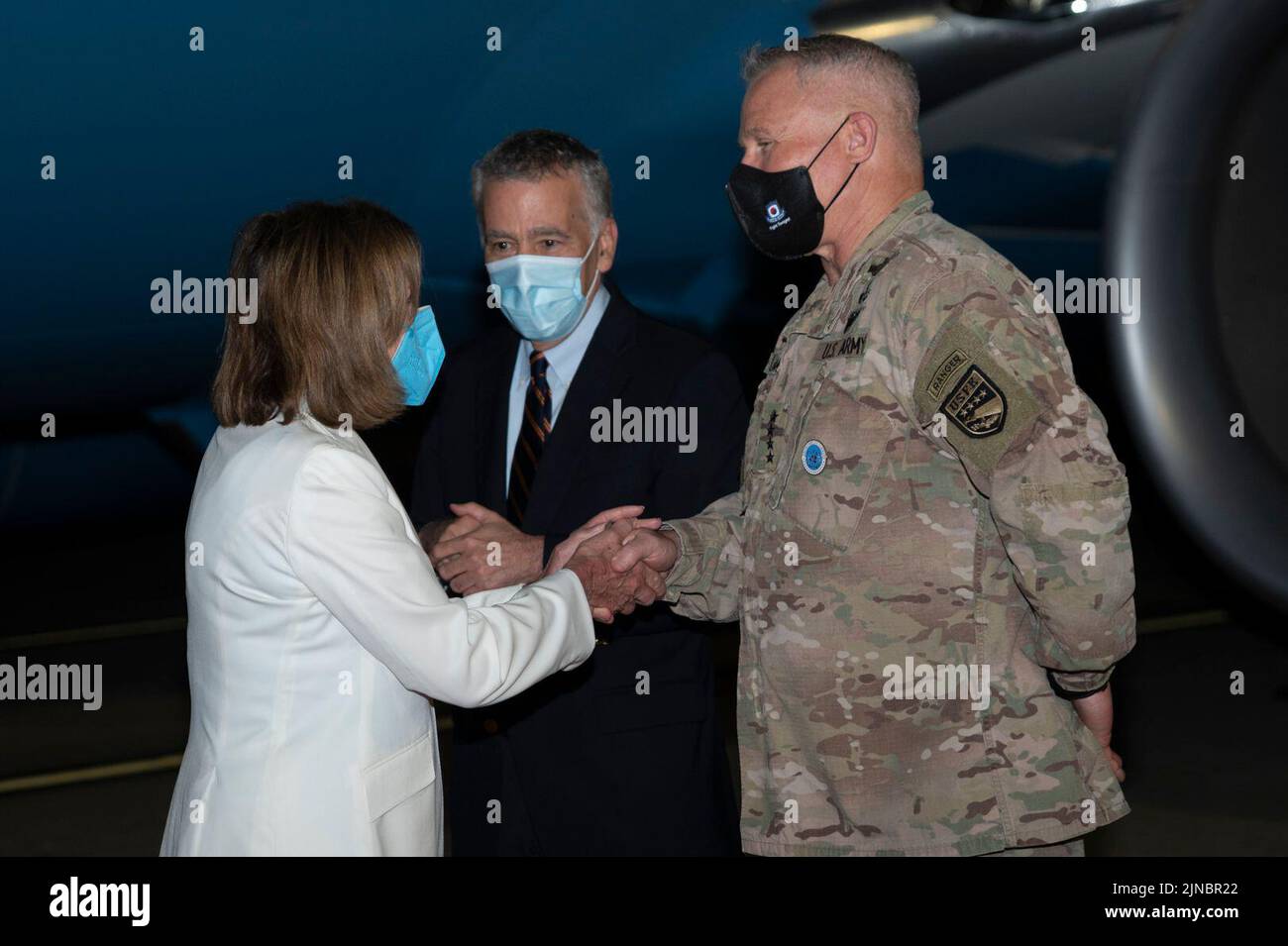 Nancy Pelosi, speaker of the U.S. House of Representatives, shakes hands with U.S. Army Gen.  Paul LaCamera, United States Forces Korea commander, at Osan Air Base, Republic of Korea, Aug 3, 2022. Pelosi and a Congressional delegation visited the Republic of Korea as part of her Indo-Pacific tour where they focused on mutual security, economic partnerships and democratic governance in the region. (U.S. Air Force photo by Senior Airman Trevor Gordnier) Stock Photo