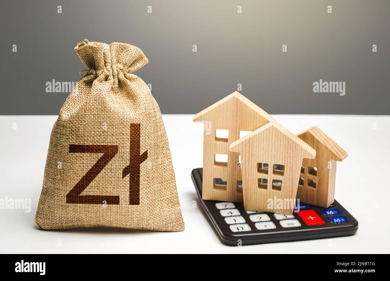 Houses on a calculator and polish zloty money bag. Buying and selling