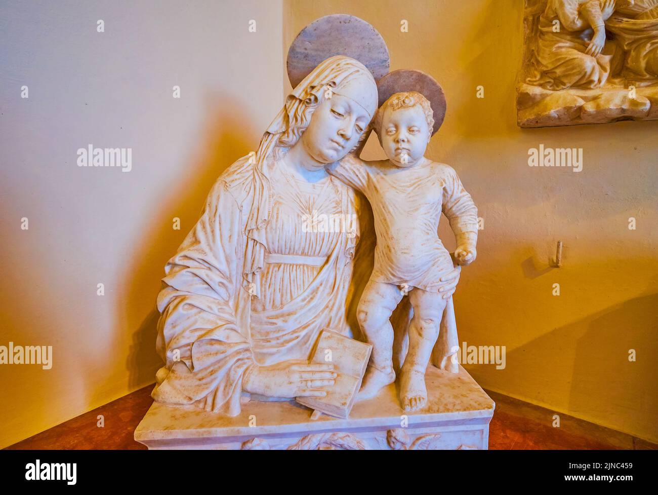 CERTOSA DI PAVIA, ITALY - APRIL 9, 2022: Medieval marble sculpture of Virgin and the Chield in Certosa Museum, on April 9 in Certosa di Pavia, Italy Stock Photo
