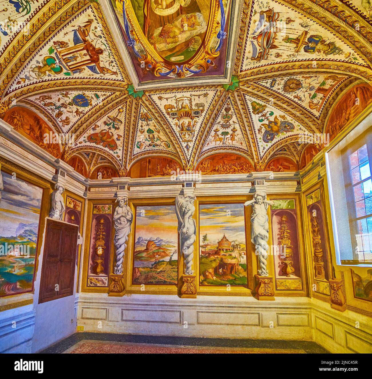 CERTOSA DI PAVIA, ITALY - APRIL 9, 2022: Studiolo room of former Ducale Palace, nowadays Certosa Museum, on April 9 in Certosa di Pavia, Italy Stock Photo