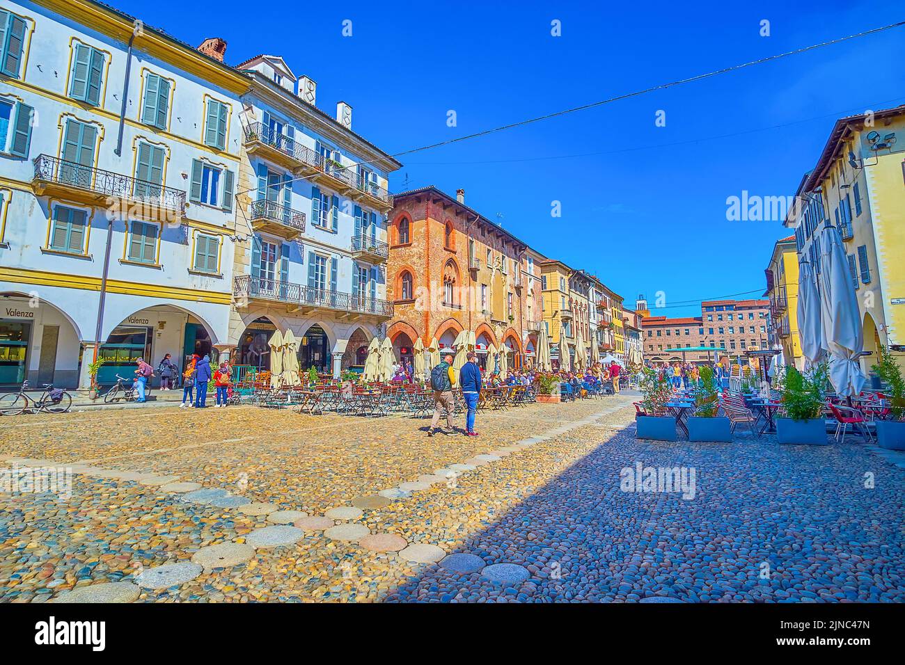 PAVIA, ITALY - APRIL 9, 2022: Piazza della Vittorio is one of the best places to have a dinner in one of numerous outdoor restaurants, on April 9 in P Stock Photo